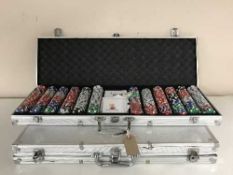 Two poker chip sets in aluminium cases