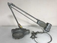 A mid 20th century industrial angle poise lamp with magnifying glass