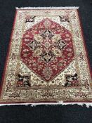 A Persian Heriz rug on red ground,