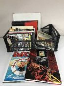 A box of graphic novels and hardback books - Dan Dare,