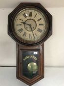 A late Victorian American Regulator clock with pendulum