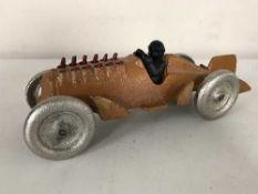 A cast metal vintage piston racing car