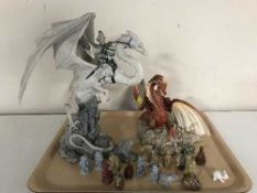 A tray of two Enchantica china ornaments and Wade whimsies