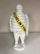 A large cast metal figure - Michelin man