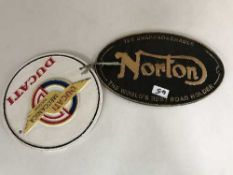 Two cast metal advertising signs - Ducati and Norton