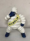 A cast metal figure - Michelin man smoking