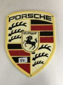 A cast metal advertising plaque - Porsche badge