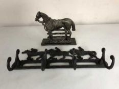A cast metal horse letter rack together with a cast metal horse racing coat rack