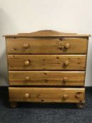 A shaped pine four drawer chest
