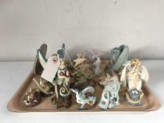 A tray of Enchantica dragon ornaments with boxes and three Enchantica books