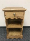 A pine bedside chest fitted a drawer