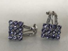 A pair of 18ct white gold tanzanite and diamond set earrings