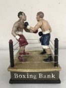 A cast metal boxing money bank