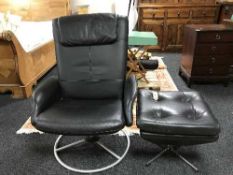 A contemporary black leather armchair on swivel base and another similar stool