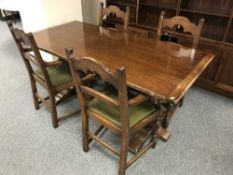 An oak refectory dining table and four chairs