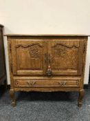 A French oak double-door cabinet