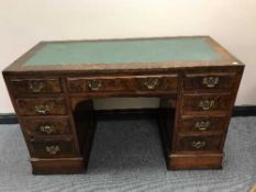 A Victorian twin pedestal desk inset green leather panel