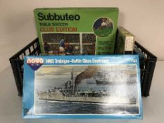 A box of Subbuteo table soccer edition, modelling kits inc.