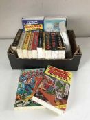 A box of nineteen assorted comics guides and a box of Classic Adventure books with magazines