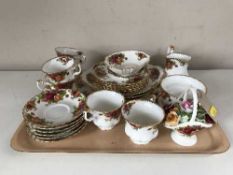 A tray of twenty eight pieces of Royal Albert Old Country Roses china and a Royal Stafford dish
