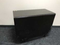 An oak drop leaf table and a silk finished peach rug