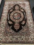 A fringed Persian carpet of zoomorphic design,