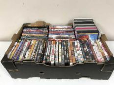 A box of assorted DVDs