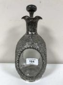 A Chinese silver mounted decanter and stopper, maker Lee Yee Hing, of dimpled square form,