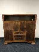A continental oak sideboard with walnut panel doors