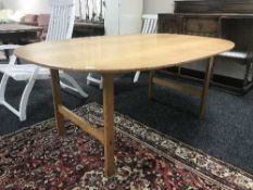 An oval oak boardroom style table