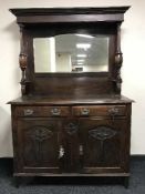 A carved Edwardian mirror backed sideboard