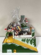 A wooden fort and two bags of plastic soldiers and a bag of Lego