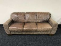 A pair of Sofa Italia leather and suede three seater settees