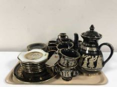 A tray of Greek ceramic black and gilt service,