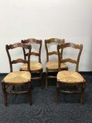 A set of nine rush seated kitchen chairs