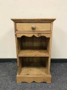 A pine bedside cabinet