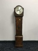 An oak granddaughter clock