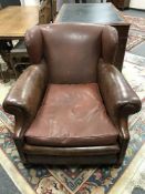 A Brown leather club armchair