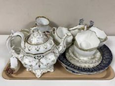Various 19th century china cups and saucers (part tea set), pair of blue and white figures,