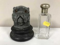 A silver topped jar and a metal inkwell in the form of a boxer dogs head