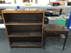 A set of mahogany open shelves and a side table