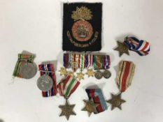 A group of six WWII medals with ribbons and accompanying miniature medals inc.