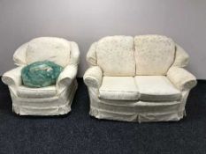 A green upholstered settee and armchair