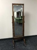 An oak bevelled cheval mirror