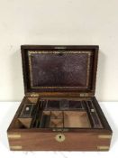 A Victorian mahogany brass bound writing box with tooled interior