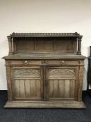 A late nineteenth century carved oak buffet sideboard
