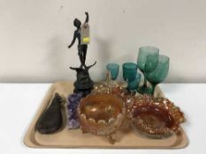 Three pieces of carnival glass, spelter figure, leather powder flask,