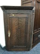 A Victorian oak hanging corner cabinet