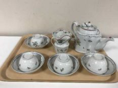 A Newhall porcelain teapot and cover, circa 1790, of commode form, puce mark to underside,