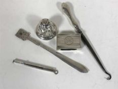 A group of silver to include a matchbox holder, pin-stand,